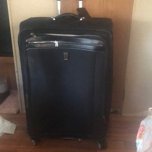Travelpro Platinum Magna expandable roller suited